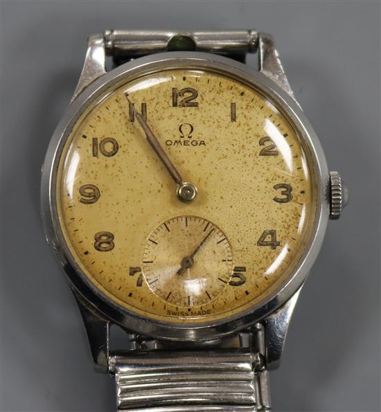A gentlemans late 1940s stainless steel Omega manual wind wrist watch,